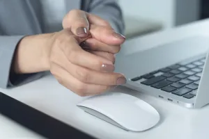 close-up of woman holding painful thumb