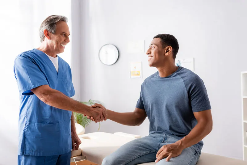 patient shaking hands with a doctor